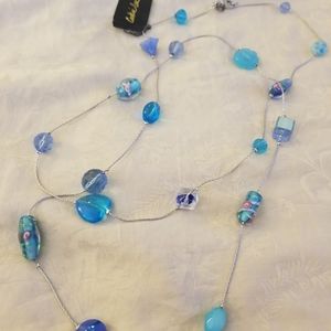 Brand New long silver with genuine crystals of blue hues necklace
